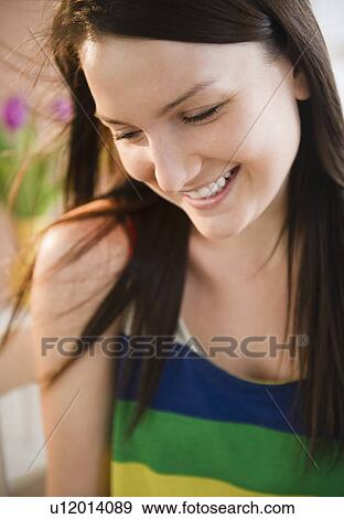 Stock Photo - Portrait of smiling young woman. Fotosearch
