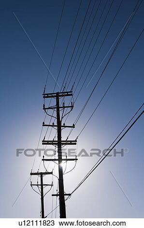 Stock Image - Power line against blue sky. Fotosearch