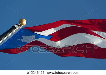 Stock Photography - Puerto Rico, Old San Juan, Close up of Puerto Rican flag against blue sky. Fotosearch
