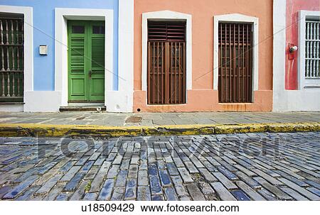 Stock Photo - Puerto Rico, Old San Juan, door in houses on brick street. Fotosearch