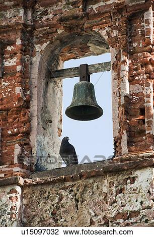 Puerto Rico, Old San Juan, pigeon perched on bell tower View Large Photo Image Stock Image - Puerto Rico, Old San Juan, pigeon perched on bell tower. Fotosearch