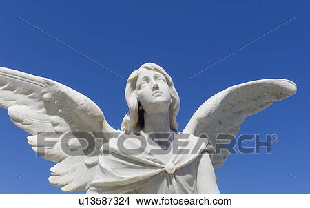 Puerto Rico, Old San Juan, Santa Maria Magdalena Cemetery, Close-up view of praying angel statue View Large Photo Image Picture - Puerto Rico, Old San Juan, Santa Maria Magdalena Cemetery, Close-up view of praying angel statue. Fotosearch