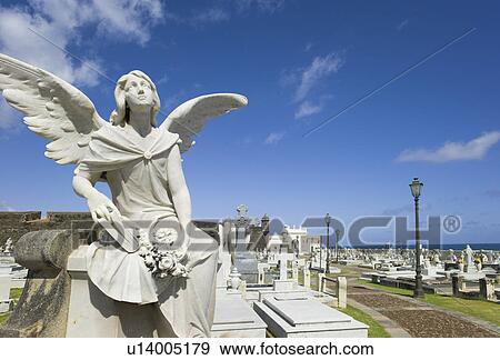 Stock Photo - Puerto Rico, Old San Juan, Santa Maria Magdalena Cemetery with El Morro Fortress in background . Fotosearch