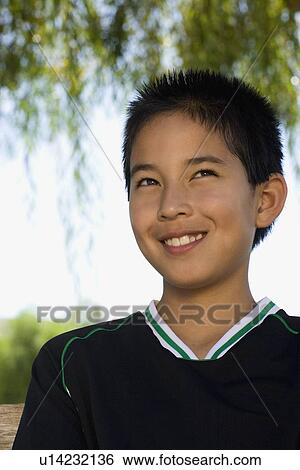 Stock Photograph - School boy (12-13) smiling. Fotosearch