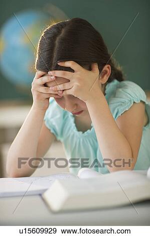 Schoolgirl (8-9) reading book View Large Photo Image Stock Photo - Schoolgirl (8-9) reading book. Fotosearch