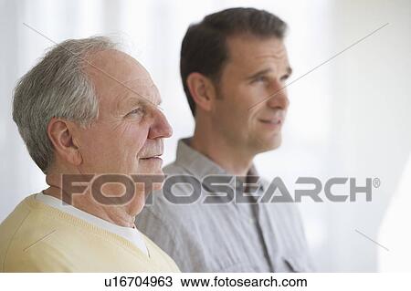 Stock Image - Senior father with adult son. Fotosearch