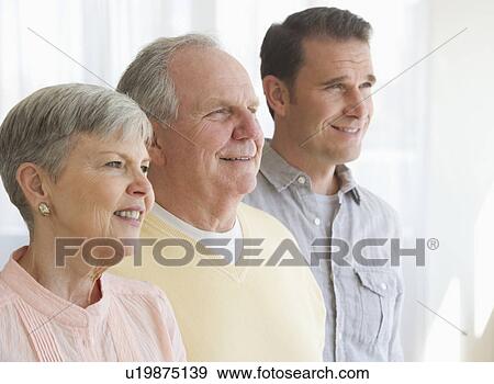 Senior parents with adult son View Large Photo Image Stock Photo - Senior parents with adult son. Fotosearch