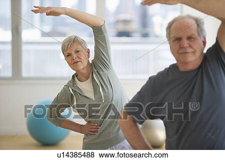 Stock Photo - Senior people exercising. Fotosearch