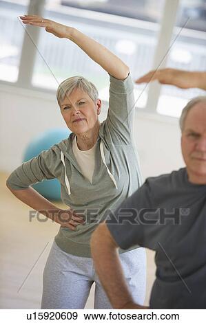 Stock Photo - Senior people exercising. Fotosearch