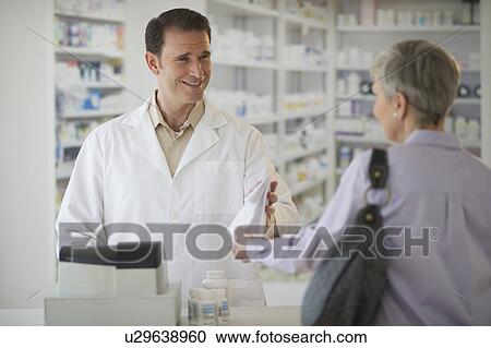 Senior woman talking to pharmacist View Large Photo Image Stock Image - Senior woman talking to pharmacist. Fotosearch