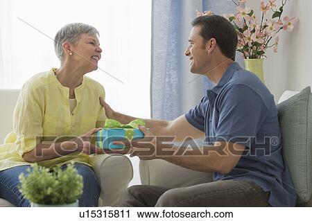Senior woman with adult son View Large Photo Image Stock Image - Senior woman with adult son. Fotosearch
