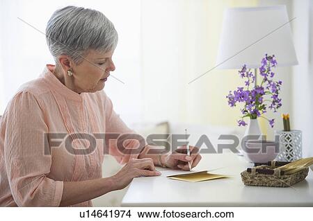 Picture - Senior woman writing letter. Fotosearch