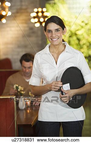 Smiling waitress in restaurant View Large Photo Image Stock Image - Smiling waitress in restaurant. Fotosearch