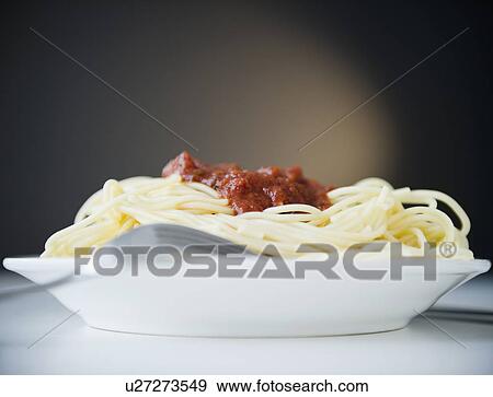 Stock Photo - Spaghetti with tomato sauce, studio shot. Fotosearch