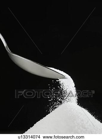Picture - Spoon and heap of sugar. Fotosearch