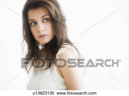Studio portrait of young woman View Large Photo Image Stock Image - Studio portrait of young woman. Fotosearch