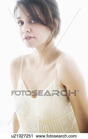 Stock Image - Studio portrait of young woman. Fotosearch
