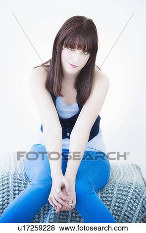 Stock Photo - Studio portrait of young woman. Fotosearch