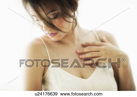 Studio portrait of young woman View Large Photo Image Stock Photo - Studio portrait of young woman. Fotosearch