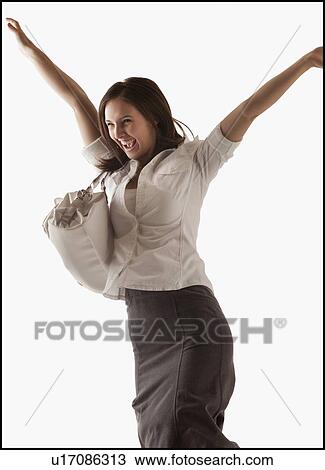 Studio shot of cheering woman View Large Photo Image Stock Image - Studio shot of cheering woman. Fotosearch