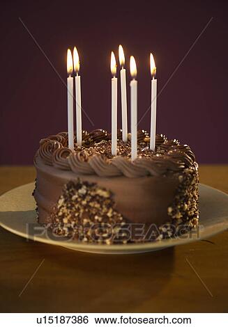 Stock Photograph - Studio shot of chocolate birthday cake. Fotosearch