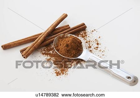 Studio shot of cinnamon stick and cinnamon powder View Large Photo Image Stock Image - Studio shot of cinnamon stick and cinnamon powder. Fotosearch