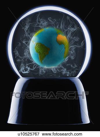 Stock Photo - Studio shot of crystal ball showing globe inside. Fotosearch