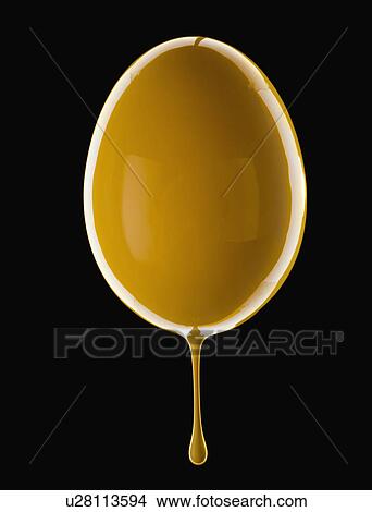 Studio shot of egg covered with yellow paint View Large Photo Image Picture - Studio shot of egg covered with yellow paint. Fotosearch