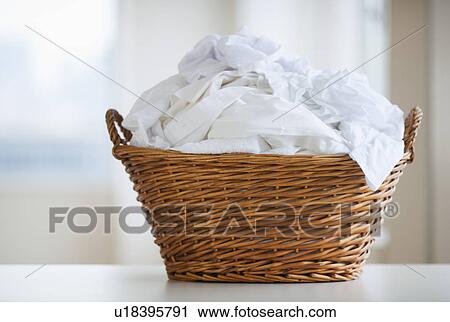 Stock Image - Studio shot of laundry basket. Fotosearch