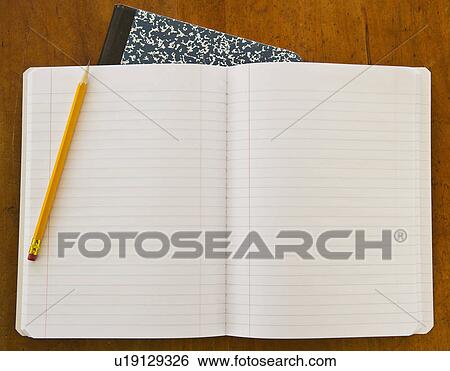 Studio shot of open notebook with yellow pencil View Large Photo Image Stock Photograph - Studio shot of open notebook with yellow pencil. Fotosearch