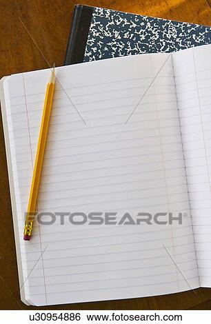 Studio shot of open notebook with yellow pencil View Large Photo Image Stock Photograph - Studio shot of open notebook with yellow pencil. Fotosearch