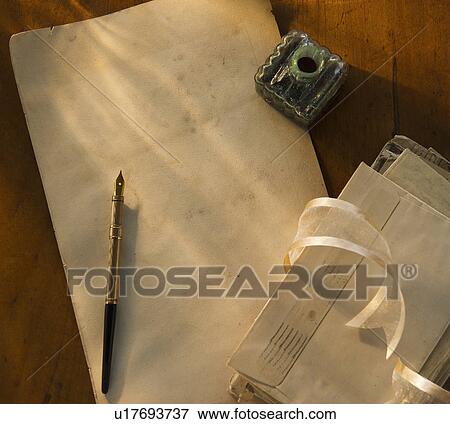 Stock Photo - Studio shot of pen, ink well and envelops. Fotosearch