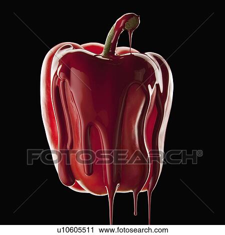 Stock Image - Studio shot of red bell pepper covered with red paint. Fotosearch