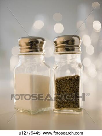 Stock Photography - Studio shot of salt and pepper shakers. Fotosearch
