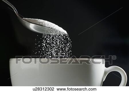 Studio shot of sugar poured into coffee cup View Large Photo Image Stock Image - Studio shot of sugar poured into coffee cup. Fotosearch