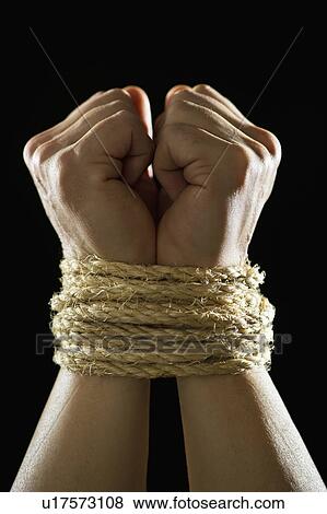 Stock Photo - Studio shot of tied hands. Fotosearch