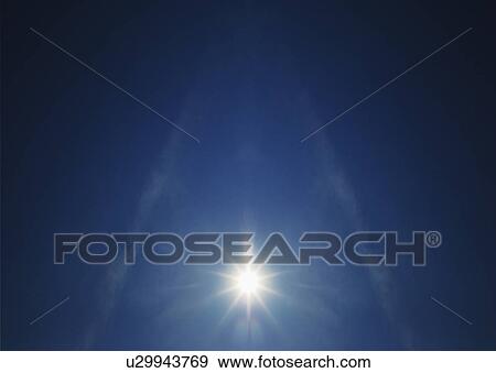 Stock Photo - Sun on clear blue sky. Fotosearch