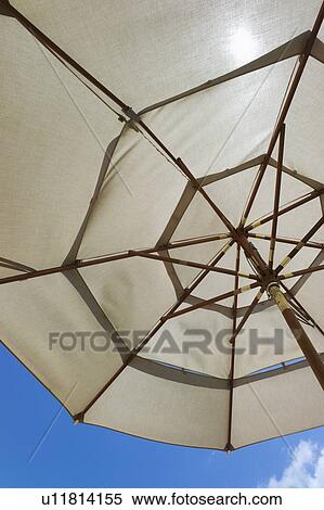 Sunshade against blue sky View Large Photo Image Stock Photography - Sunshade against blue sky. Fotosearch