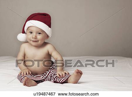 Stock Photo - Surprised baby boy (6-11 months) . Fotosearch