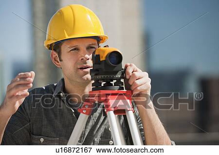 Surveyor using theodolite View Large Photo Image Stock Photo - Surveyor using theodolite. Fotosearch