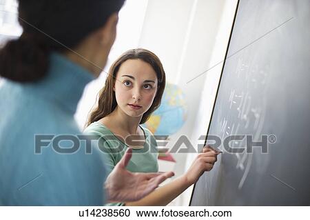 Teacher talking to teenage girl (14-15) View Large Photo Image Stock Image - Teacher talking to teenage girl (14-15). Fotosearch