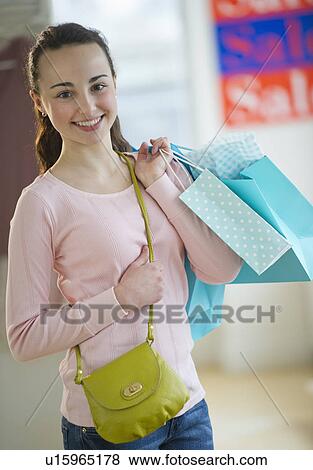 Teenage girl (14-15) shopping View Large Photo Image Stock Photo - Teenage girl (14-15) shopping. Fotosearch
