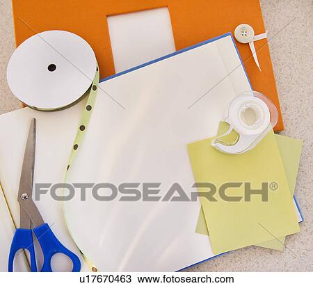 Stock Image - Unfinished scrapbook and materials. Fotosearch
