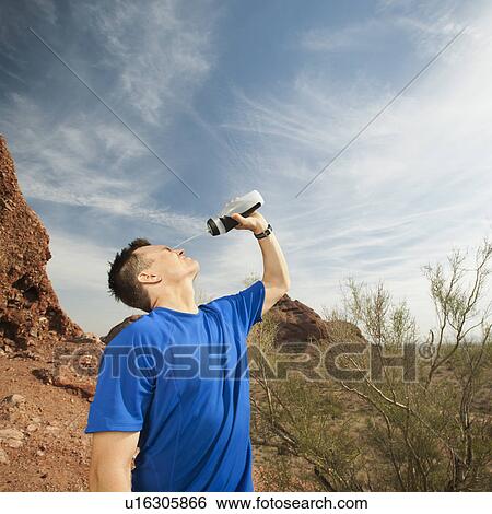 USA, Arizona, Phoenix, Man pouring water on his face View Large Photo Image Stock Photograph - USA, Arizona, Phoenix, Man pouring water on his face. Fotosearch