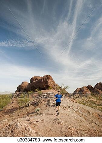 USA, Arizona, Phoenix, Mid adult man jogging on desert View Large Photo Image Stock Image - USA, Arizona, Phoenix, Mid adult man jogging on desert. Fotosearch