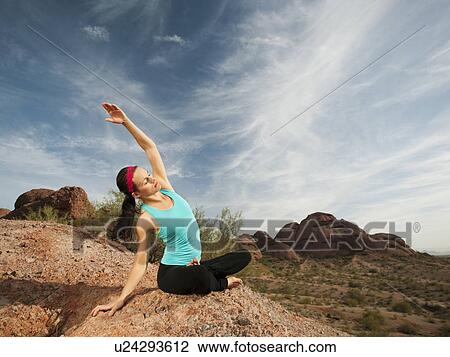 USA, Arizona, Phoenix, Young woman practicing yoga on desert View Large Photo Image Stock Image - USA, Arizona, Phoenix, Young woman practicing yoga on desert. Fotosearch