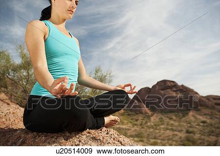 USA, Arizona, Phoenix, Young woman practicing yoga on desert View Large Photo Image Stock Photo - USA, Arizona, Phoenix, Young woman practicing yoga on desert. Fotosearch