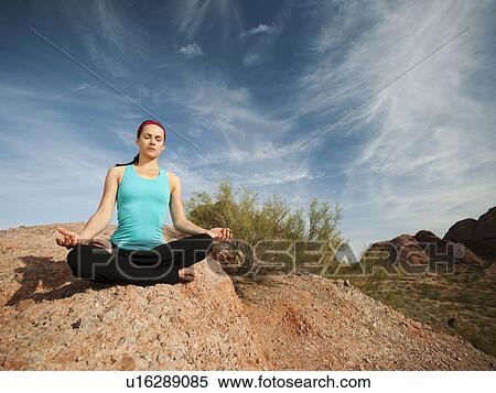 USA, Arizona, Phoenix, Young woman practicing yoga on desert View Large Photo Image Stock Photography - USA, Arizona, Phoenix, Young woman practicing yoga on desert. Fotosearch