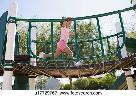Stock Photo - USA, California, Girl (4-5) playing in playground. Fotosearch