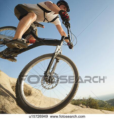 USA, California, Laguna Beach, Close up of mountain biker riding downhill View Large Photo Image Stock Photo - USA, California, Laguna Beach, Close up of mountain biker riding downhill. Fotosearch